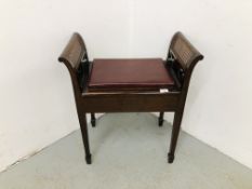 A MAHOGANY MUSIC STOOL WITH BERGERE PANEL DETAIL AND HINGED SEAT