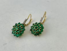 PAIR OF 9CT GOLD EMERALD CLUSTER STYLE EARRINGS THE DROP MOUNTS SET WITH 4 SMALL DIAMONDS