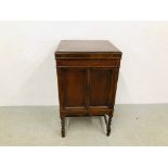 AN OAK TWO DOOR CABINET STANDING ON BARLEY TWIST LEGS (FORMERLY A GRAMOPHONE CABINET)