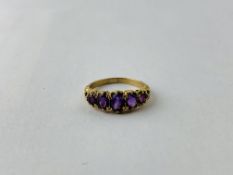 A 9CT GOLD FIVE STONE AMETHYST SET LADIES RING