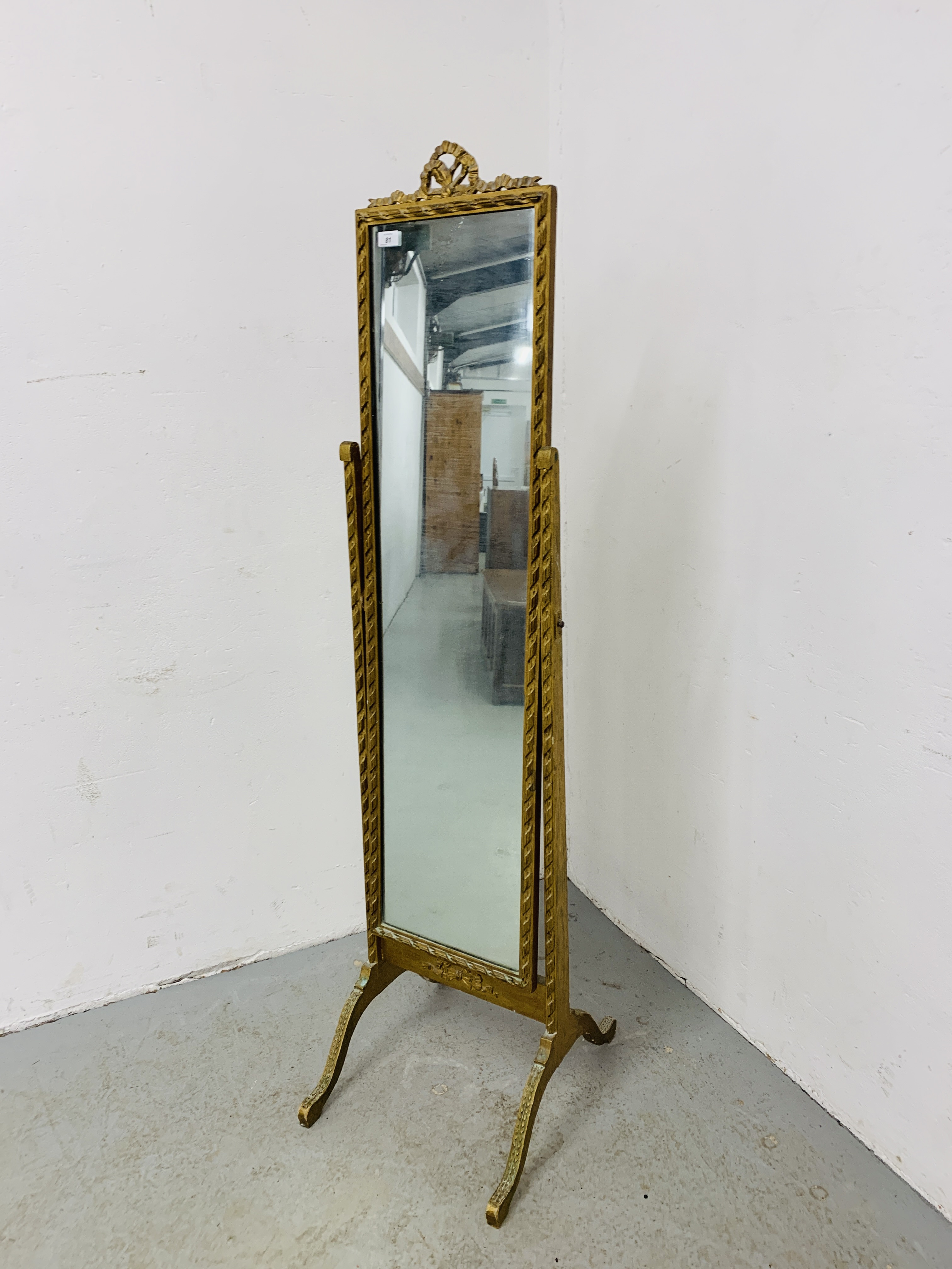 A GILT FRAMED CHEVAL MIRROR