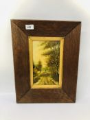 AN OAK FRAMED OIL ON PANEL DEPICTING A SHEPHERD WITH SHEEP ON COUNTRY LANE - 14 X 25CM BEARING