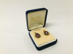 A PAIR OF 9CT GOLD AMETHYST PEAR SHAPED PENDANT EARRINGS