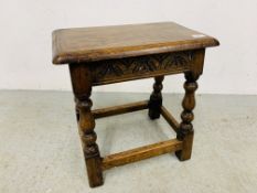 AN OAK JOINT STOOL WITH CARVED FREIZE RAILS