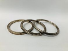 THREE SILVER BANGLES MARKED C.H.