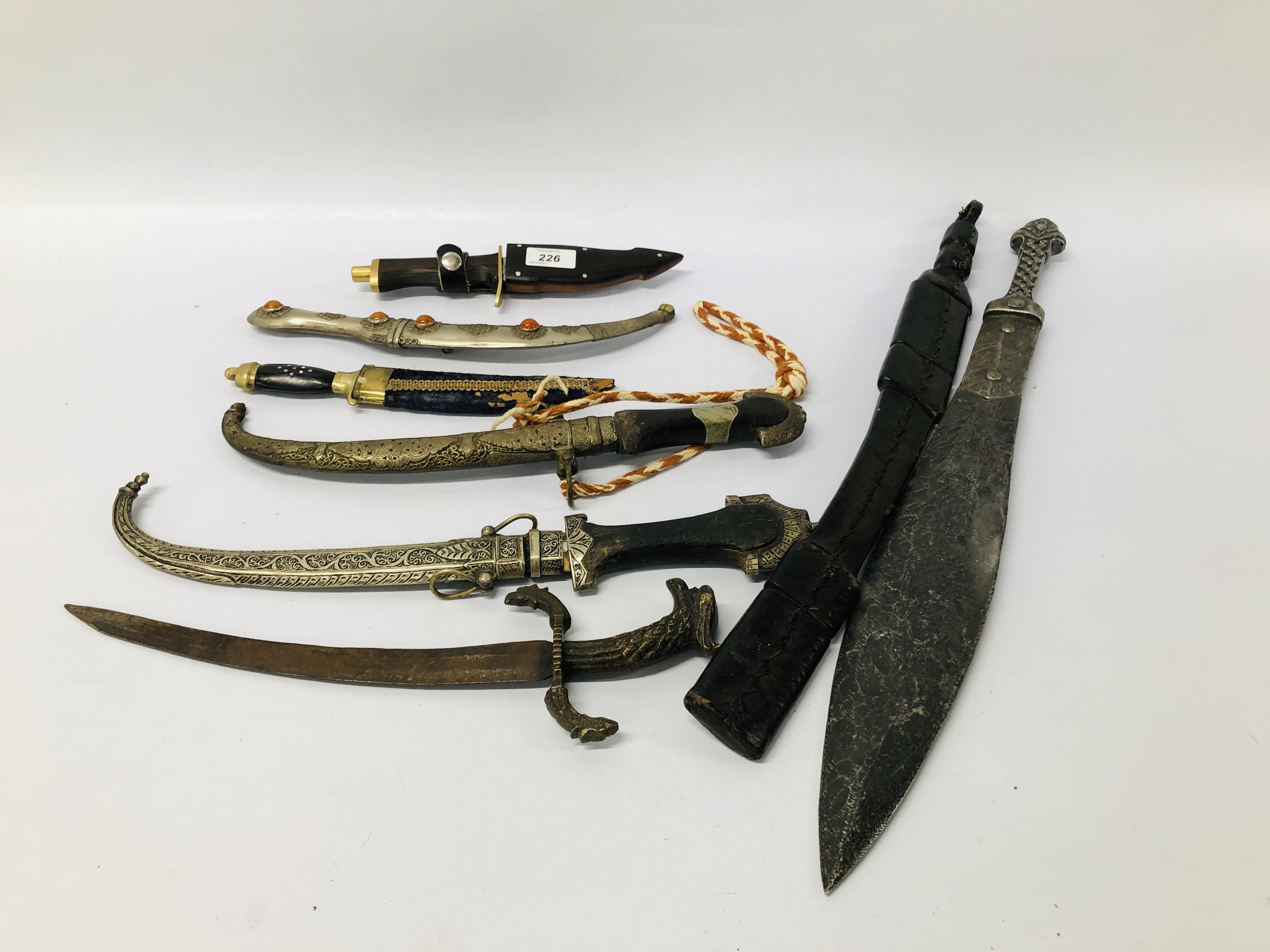 A COLLECTION OF EIGHT VARIOUS DECORATIVE MAINLY EASTERN DAGGERS