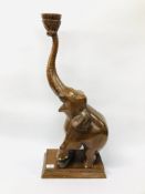 A CARVED HARDWOOD FIGURE OF AN ELEPHANT OVERALL HEIGHT 75CM.
