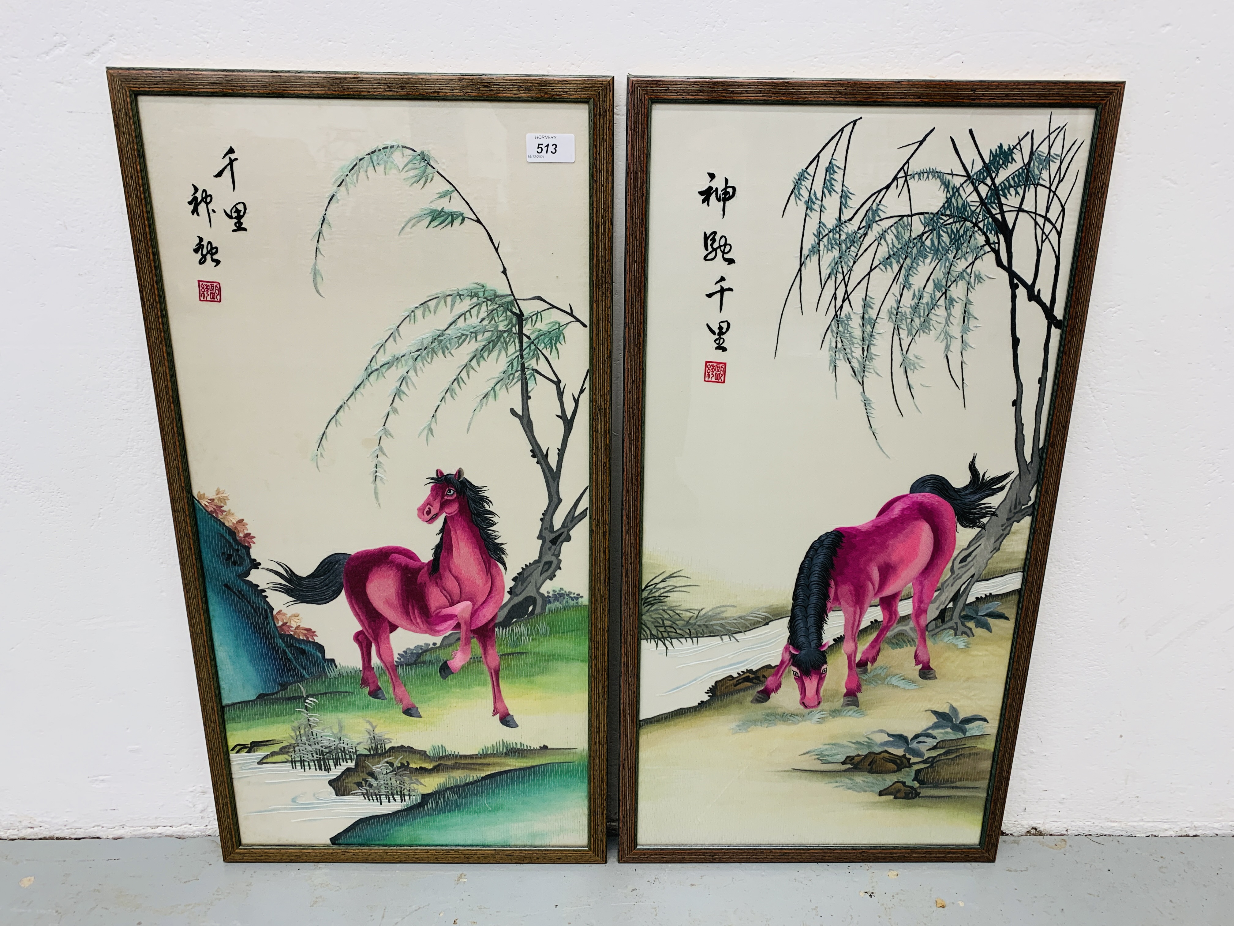 A PAIR OF FRAMED ORIENTAL EMBROIDERIES ON SILK DEPICTING PINK HORSES EACH - W 39CM. H 75CM.