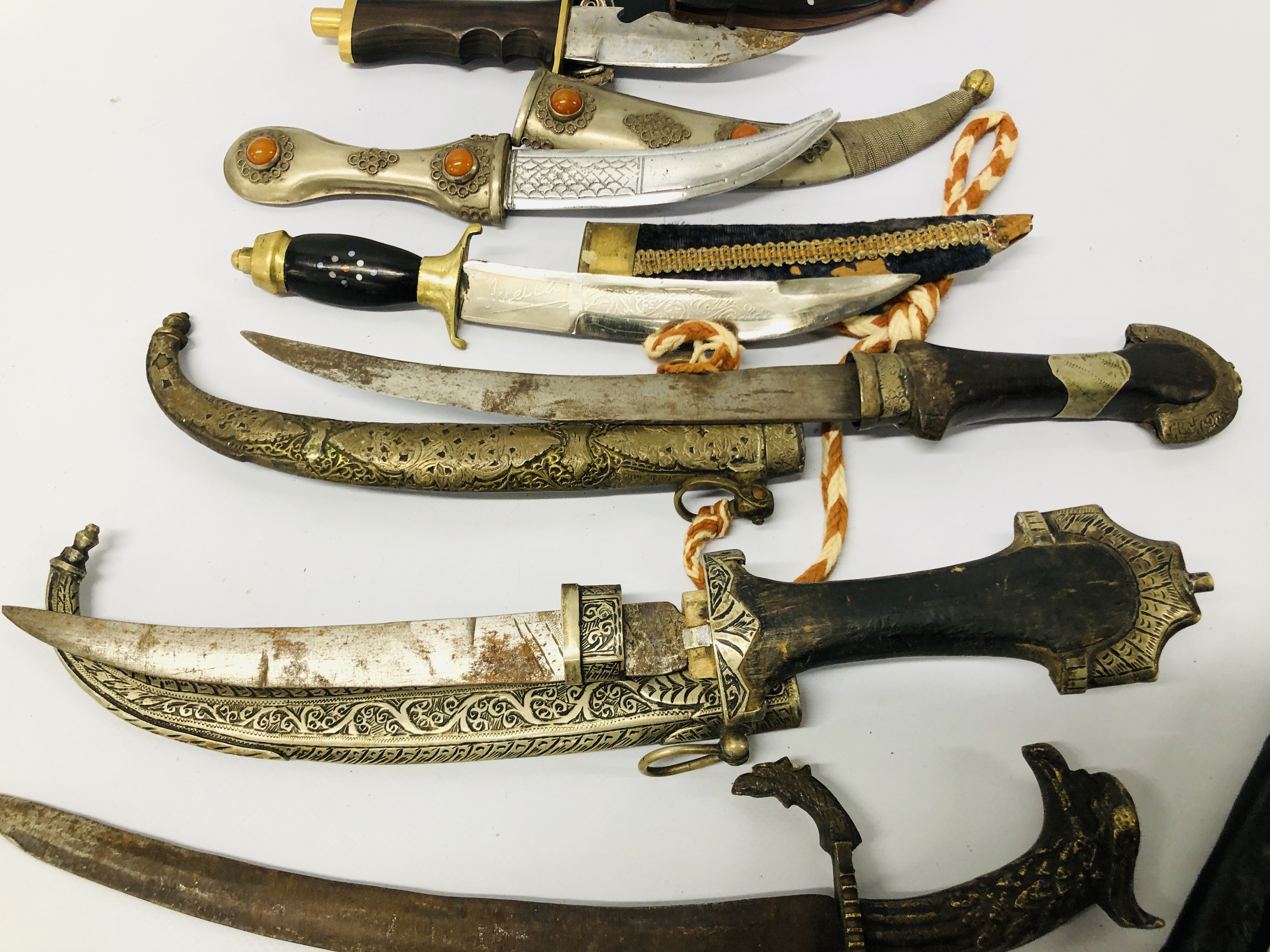 A COLLECTION OF EIGHT VARIOUS DECORATIVE MAINLY EASTERN DAGGERS - Image 5 of 9
