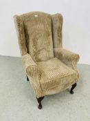 A MODERN "JUMBO CORD" WINGED FIRESIDE CHAIR