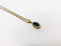 SINGLE GREEN STONE PENDANT SURROUNDED BY DIAMONDS MARKED 9K ON A FINE CHAIN MARKED 9K