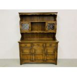 A GOOD QUALITY REPRODUCTION OAK DRESSER - W 137CM. D 44CM. H 183CM.