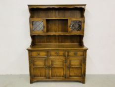 A GOOD QUALITY REPRODUCTION OAK DRESSER - W 137CM. D 44CM. H 183CM.