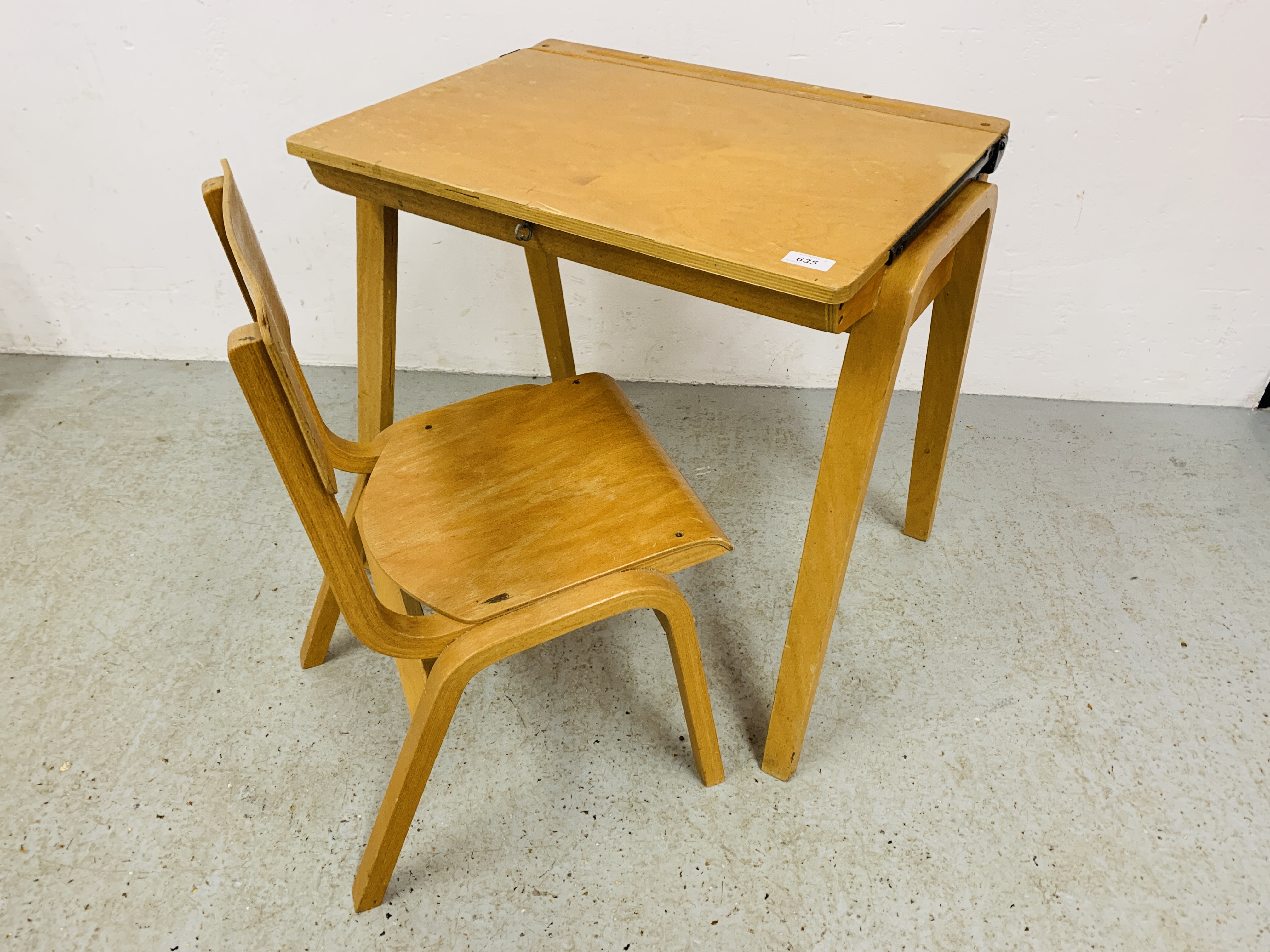 A SMALL CHILD'S DESK AND MATCHING CHAIR