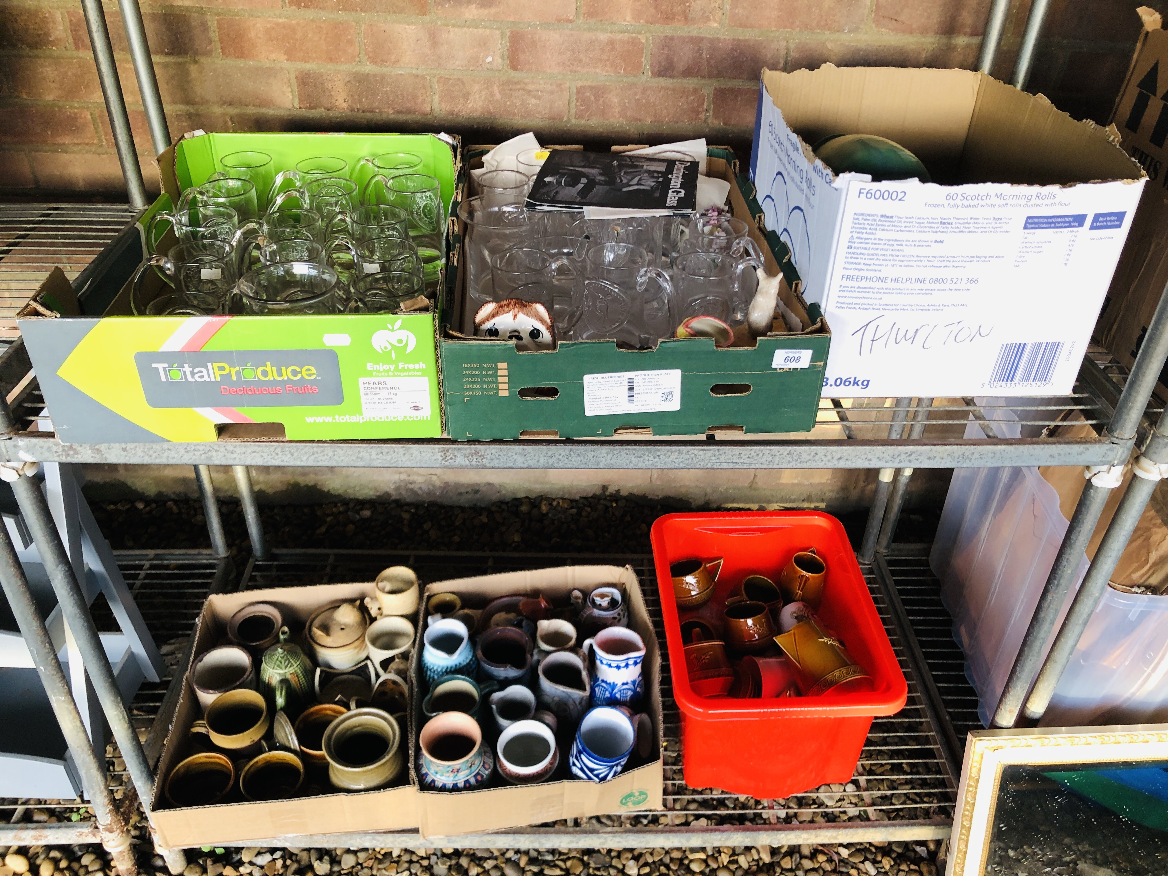 A COLLECTION OF DARTINGTON GLASS TANKARDS, VARIOUS POTTERY JUGS, CUPS AND CANDLE HOLDERS,