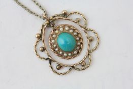 A YELLOW METAL PENDANT SET WITH A TURQUOISE CABOCHON ON AN UNMARKED YELLOW METAL CHAIN (SOME