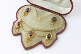 AN EARRING AND NECKLACE SET WITH PEAR SHAPED AMETHYST CABOCHONS,