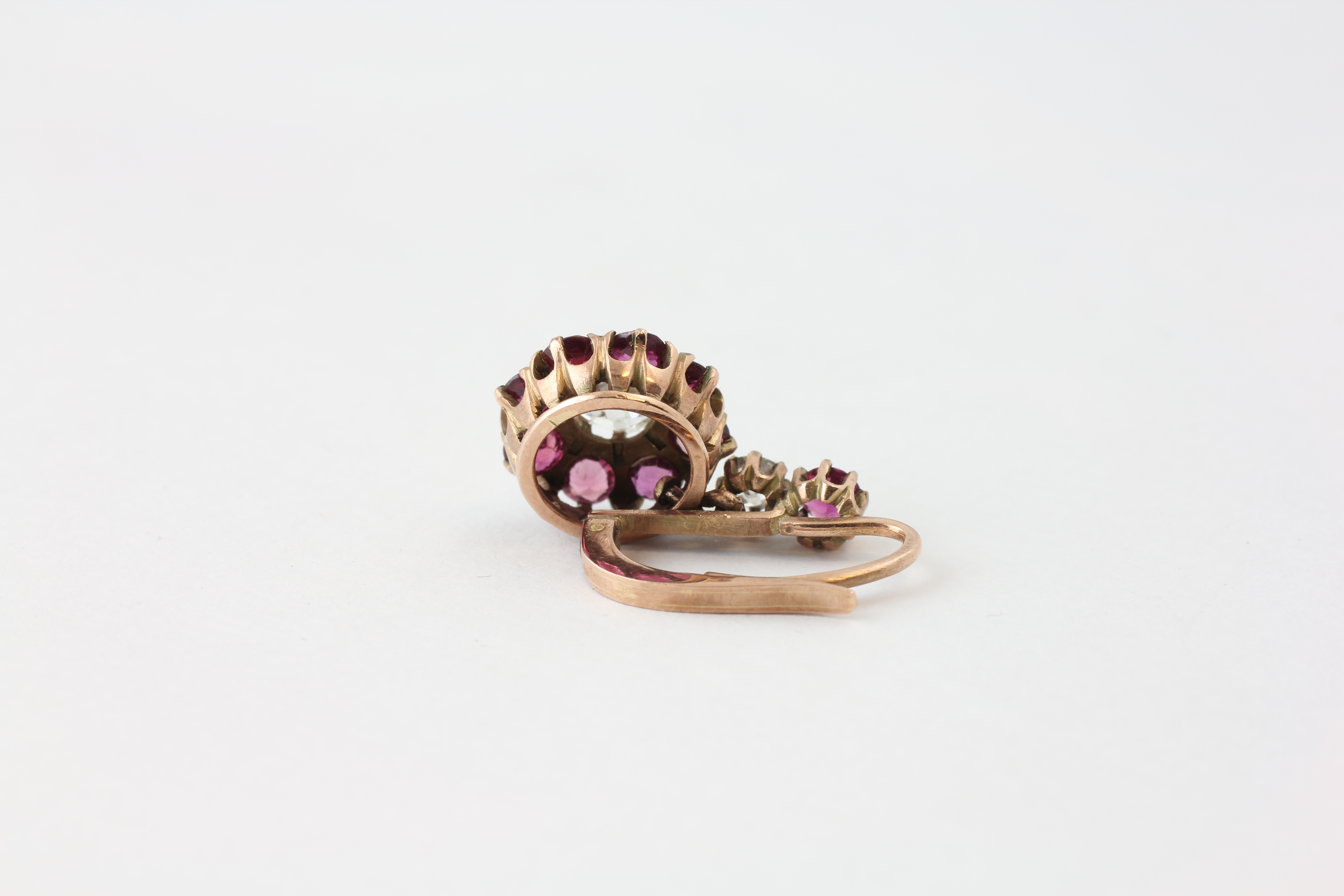 A PAIR OF DIAMOND EARRINGS, THE CENTRAL OLD CUT STONE SURROUNDED BY SMALL MAUVE STONES, - Image 5 of 6