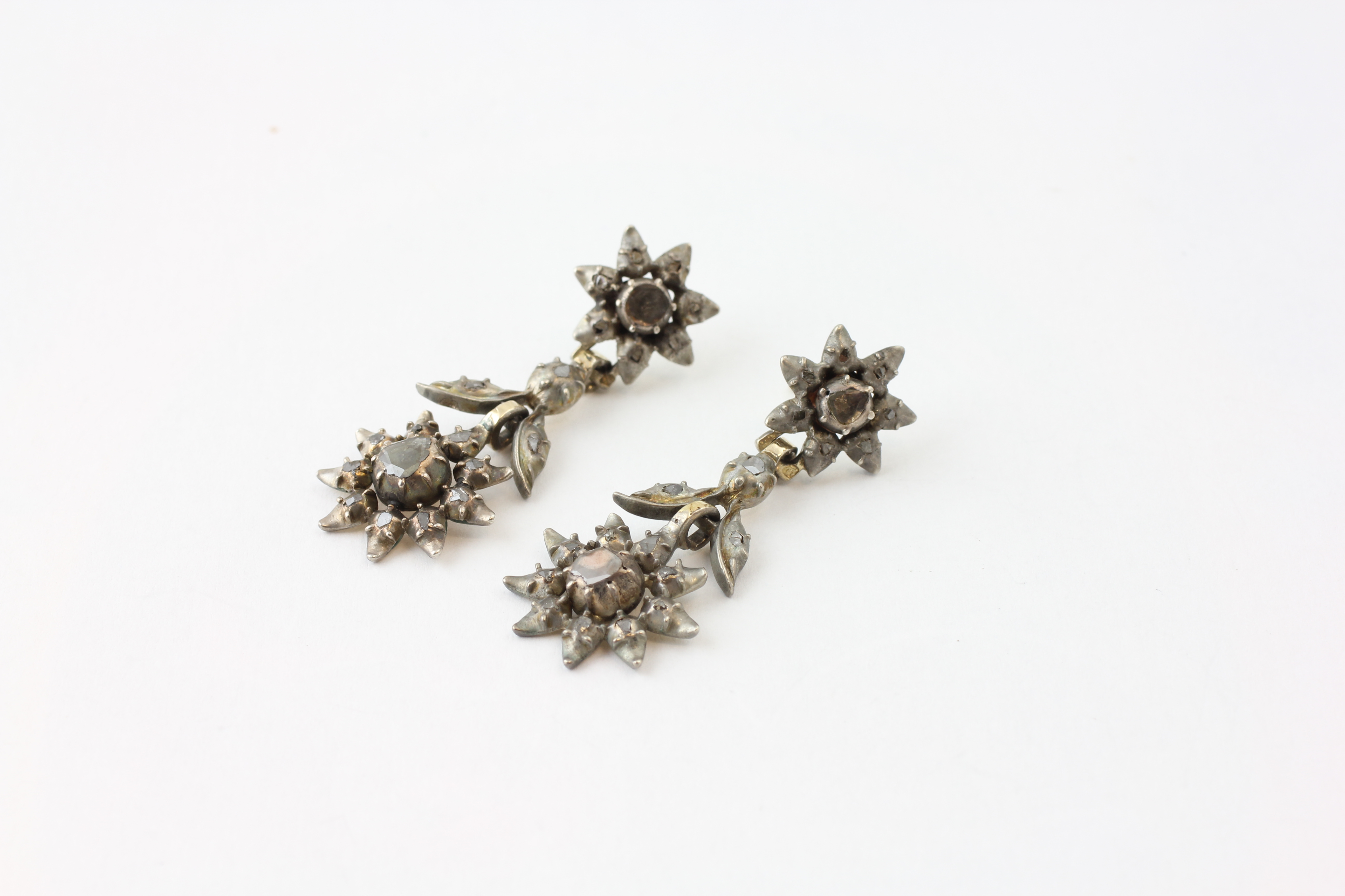 A PAIR OF DROP EARRINGS SET WITH OLD CUT DIAMONDS (POOR CLARITY),