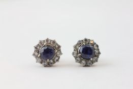 A PAIR OF SAPPHIRE AND DIAMOND STUD EARRINGS, THE PRINCIPAL STONES APPROX.