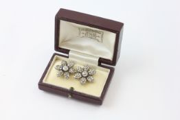 A PAIR OF STUD EARRINGS OF FLOWERHEAD DESIGN,