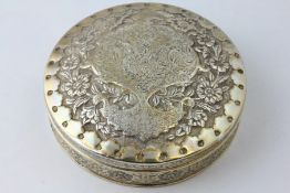 A PERSIAN WHITE METAL CIRCULAR BOX AND COVER, FLORAL DECORATION, DIAMETER 12.