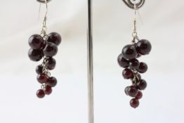 A PAIR OF GARNET AND STERLING SILVER DROP EARRINGS,