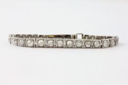 A FOURTEEN STONE DIAMOND BRACELET, THE OLD CUT STONES IN A 9CT WHITE GOLD SETTING,