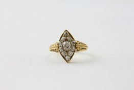 AN 18CT GOLD DIAMOND RING OF NAVETTE DESIGN, THE CENTRAL OLD CUT STONE APPROX. .