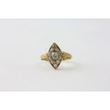 AN 18CT GOLD DIAMOND RING OF NAVETTE DESIGN, THE CENTRAL OLD CUT STONE APPROX. .