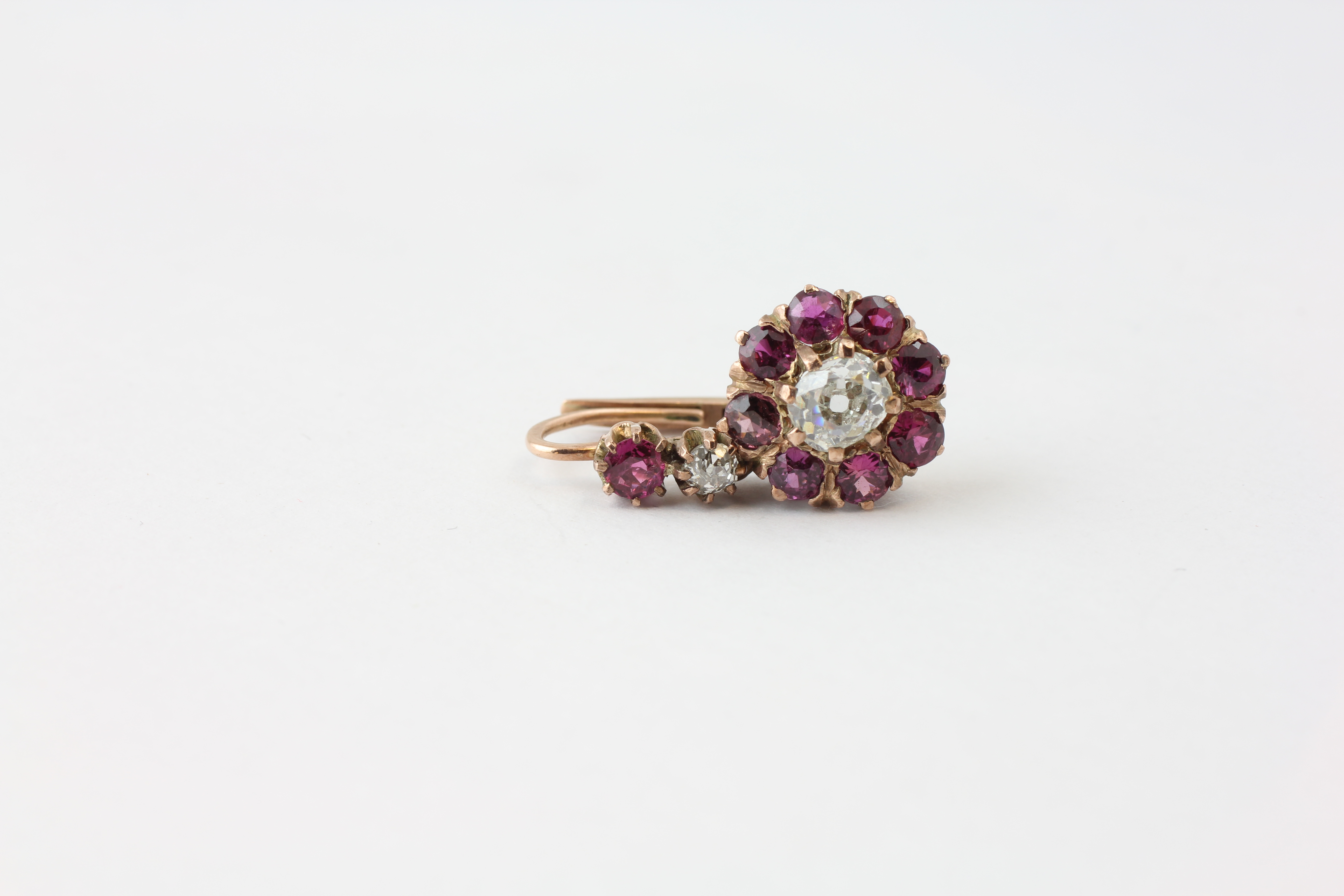 A PAIR OF DIAMOND EARRINGS, THE CENTRAL OLD CUT STONE SURROUNDED BY SMALL MAUVE STONES, - Image 6 of 6