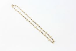 A 15CT. GOLD NECKLACE SET WITH DIAMOND CHIPS, LENGTH 37.