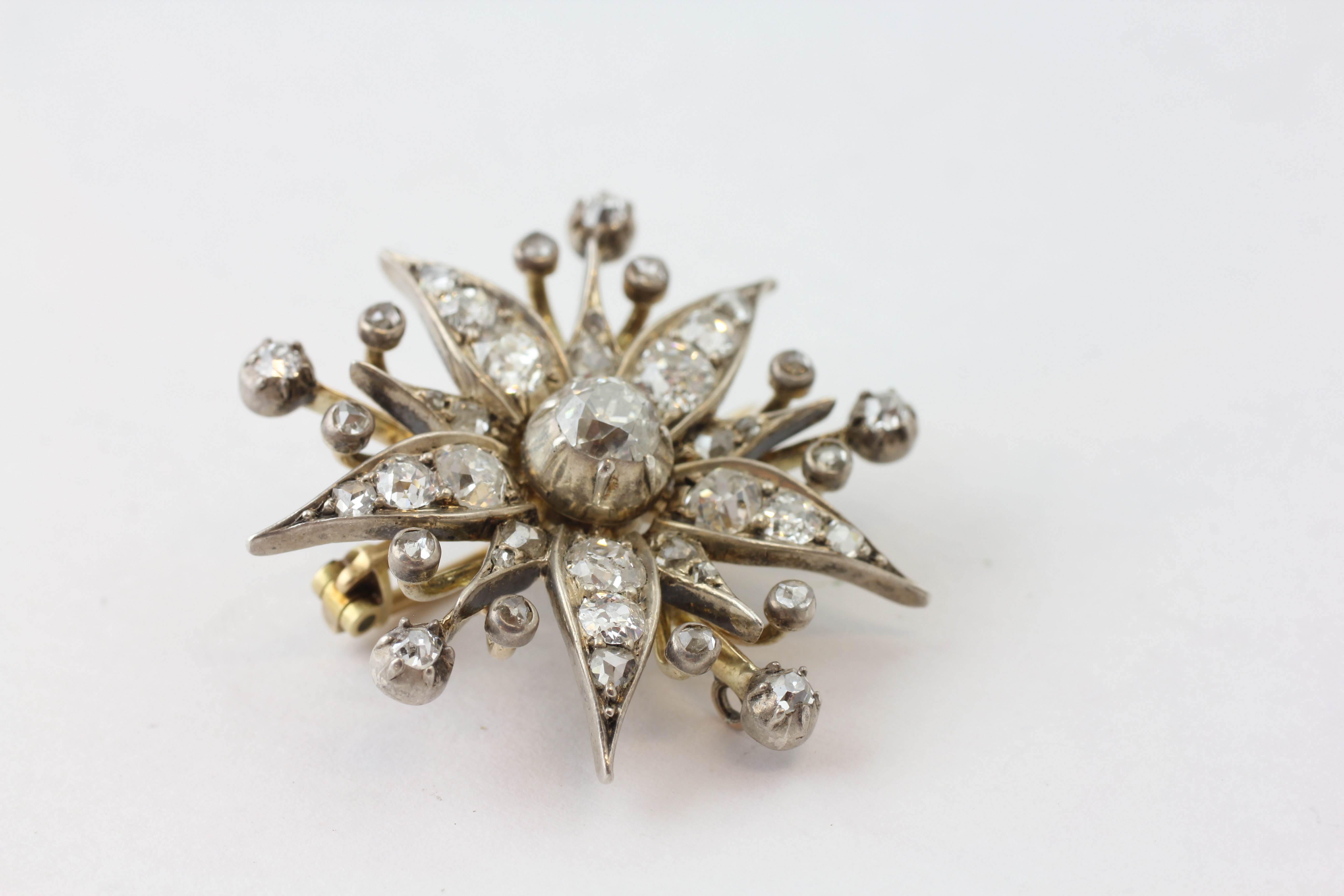 A DIAMOND BROOCH OF FLOWERHEAD FORM WITH ADJUSTMENT FOR A PENDANT, SET WITH 42 OLD CUT DIAMONDS, - Image 3 of 6