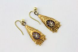 A PAIR OF YELLOW METAL PEAR SHAPED DROP EARRINGS SET WITH A PEARL IN A STAR DESIGN,