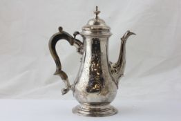 A SILVER COFFEE POT OF BALUSTER FORM WITH DOUBLE SCROLLED WOODEN HANDLE,