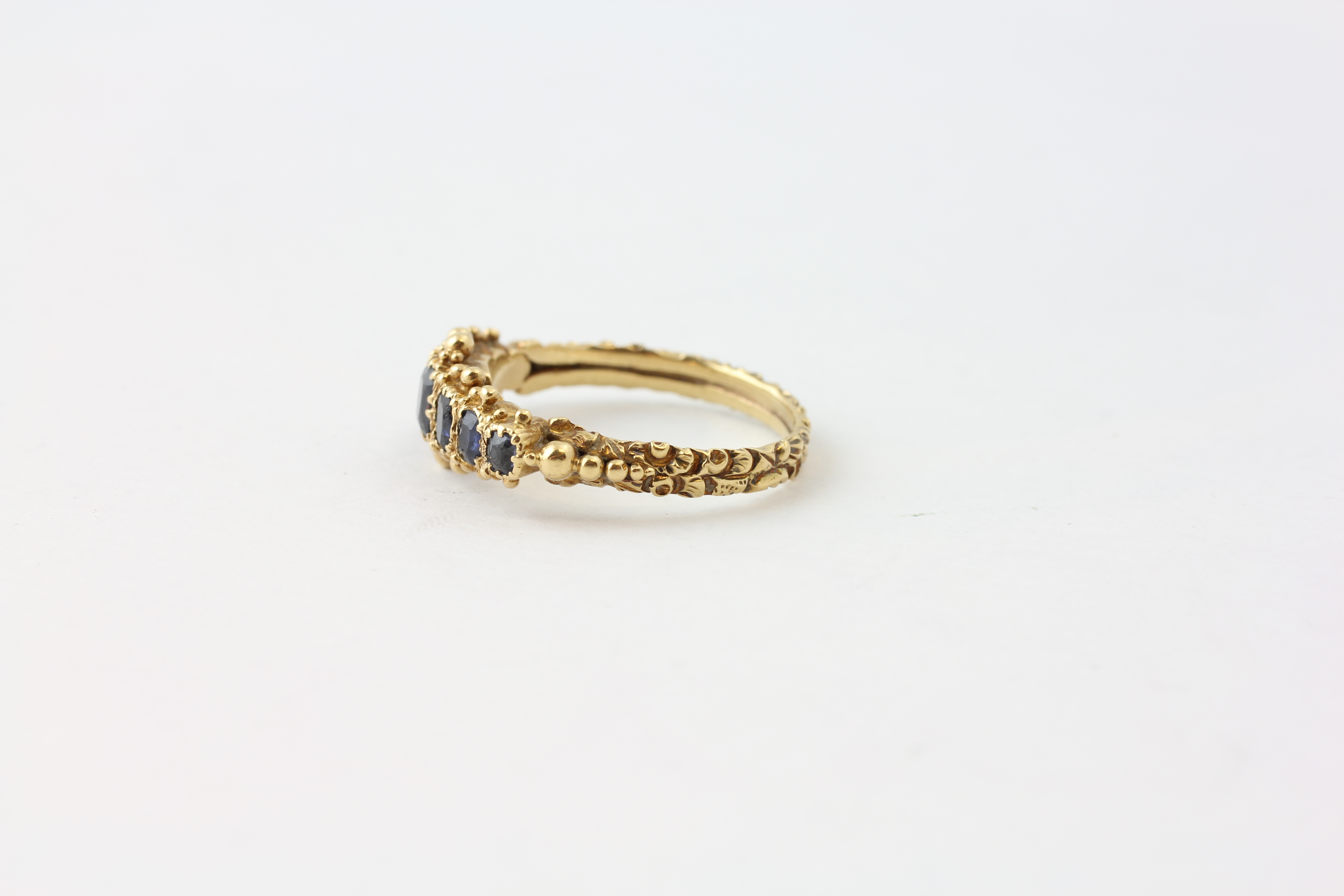A SAPPHIRE RING, FIVE GRADUATED STONES, CLAW SET IN UNMARKED GOLD, THE LARGEST STONE APPROX. - Image 3 of 5