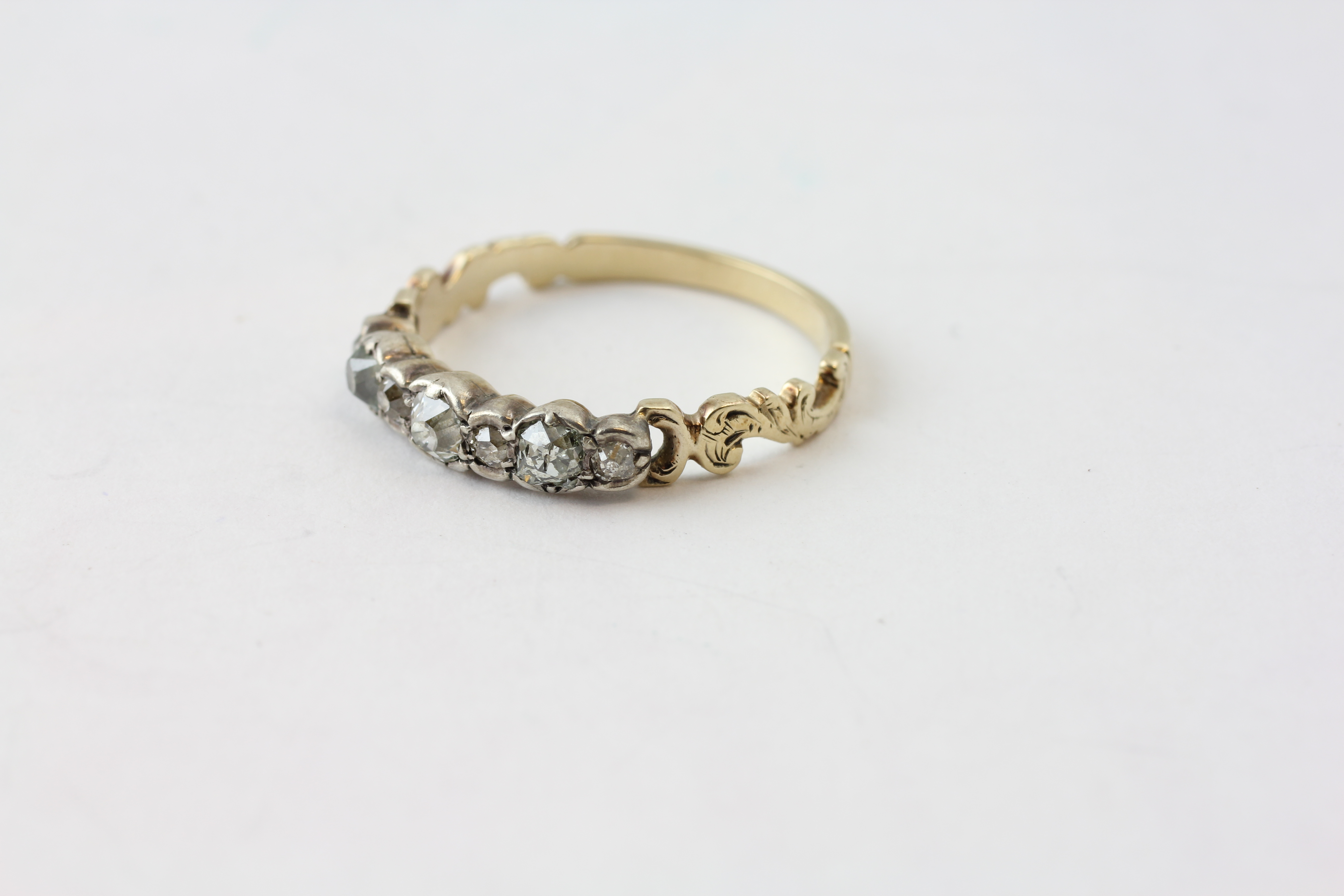 A SEVEN STONE DIAMOND RING, THE LARGEST STONE APPROX. - Image 3 of 5