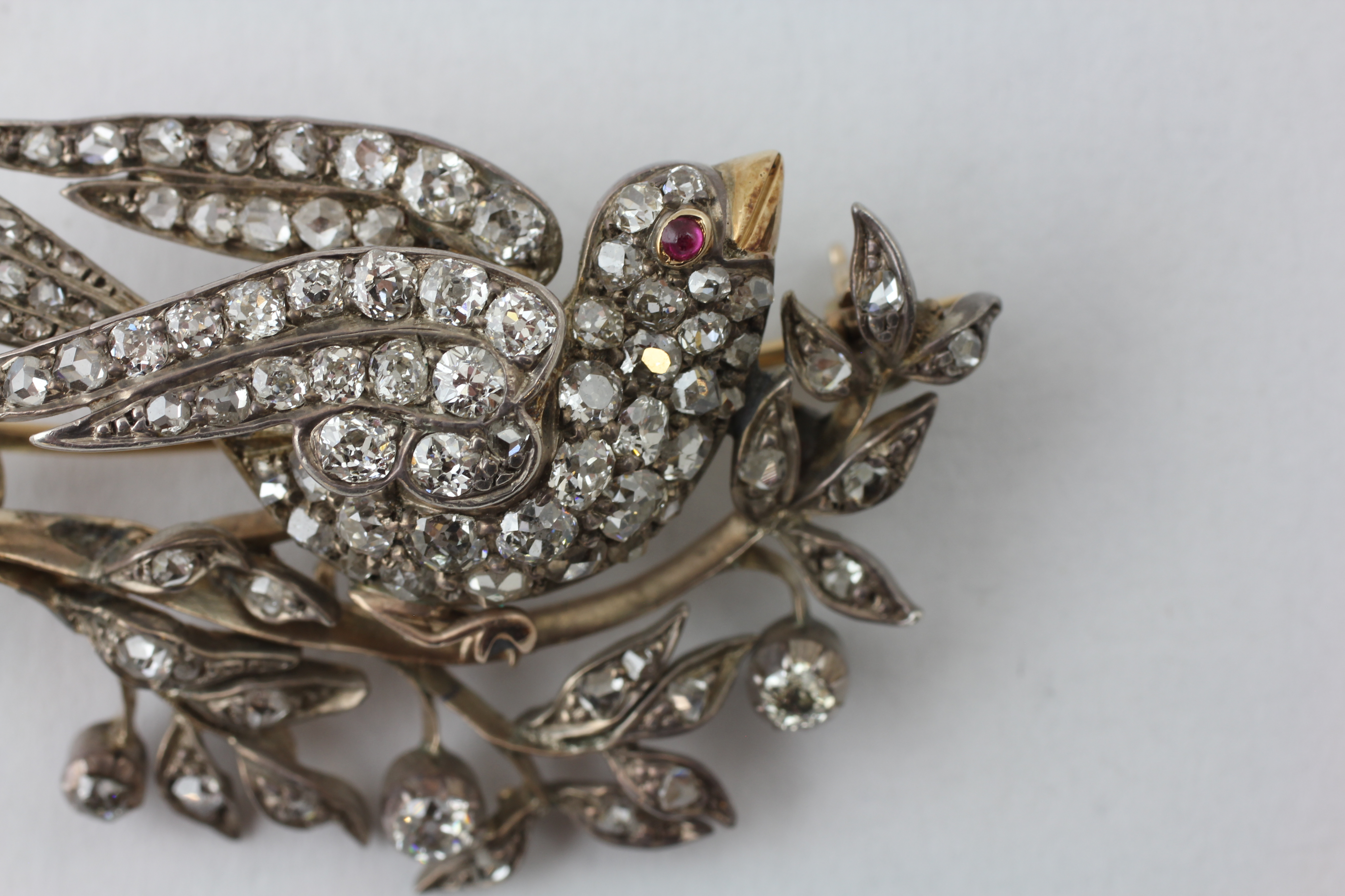 A BIRD BROOCH HAVING A RUBY EYE AND YELLOW METAL BEAK, - Image 2 of 7