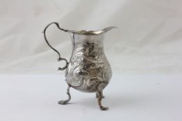 A TRIPOD CREAM JUG DECORATED WITH HOUNDS HUNTING GAME (RUBBED MARKS) HEIGHT 9.5CM, WEIGHT APPROX.