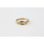 A RING OF CLASPED HAND DESIGN, MARKED 10K,