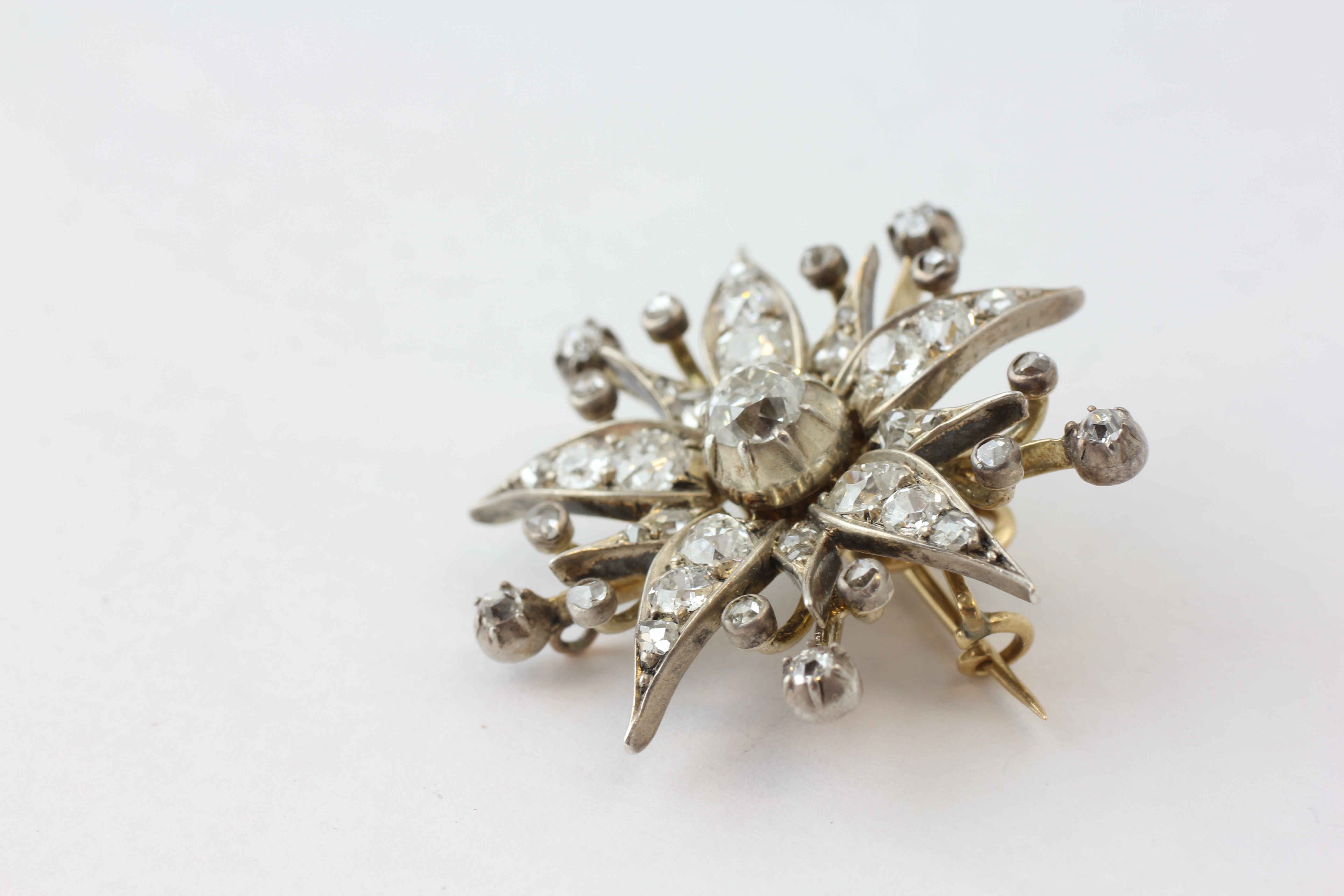 A DIAMOND BROOCH OF FLOWERHEAD FORM WITH ADJUSTMENT FOR A PENDANT, SET WITH 42 OLD CUT DIAMONDS, - Image 4 of 6