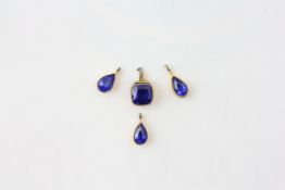 FOUR SAPPHIRES SET IN GOLD OPEN BOX DESIGN, 3 PEAR SHAPED HEIGHT 6.8MM AND ONE SQUARE CUT HEIGHT 6.