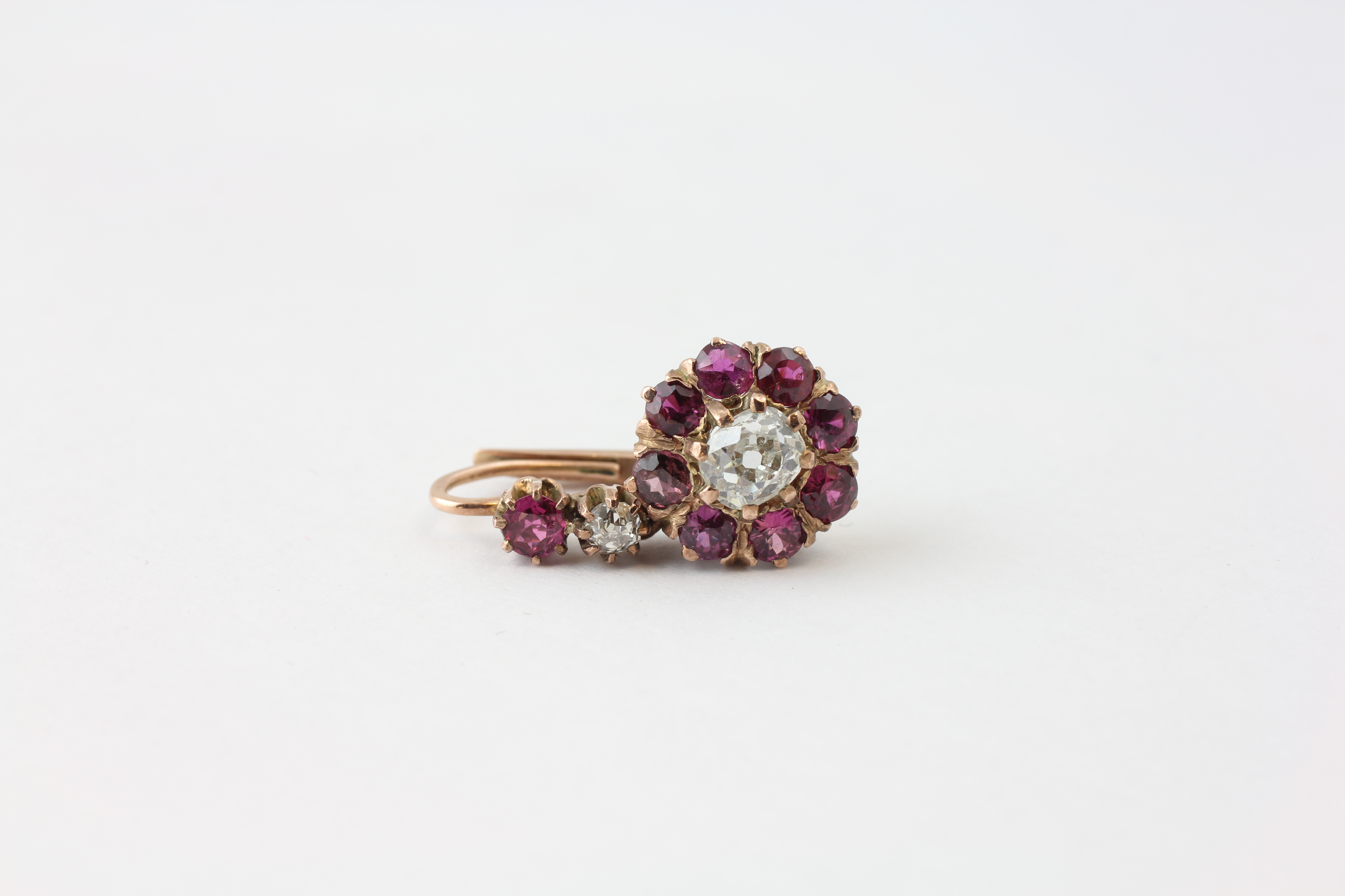 A PAIR OF DIAMOND EARRINGS, THE CENTRAL OLD CUT STONE SURROUNDED BY SMALL MAUVE STONES, - Image 3 of 6