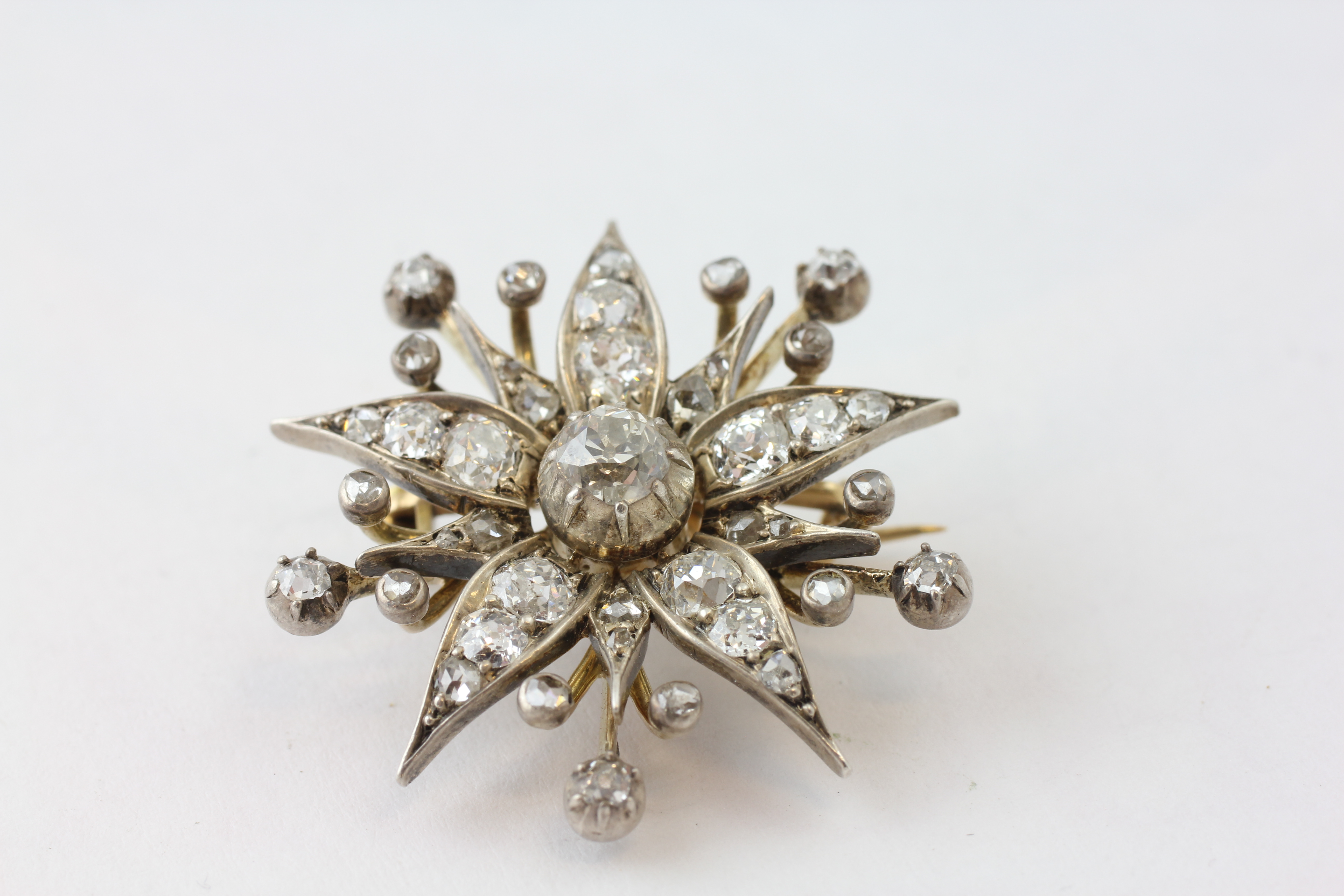 A DIAMOND BROOCH OF FLOWERHEAD FORM WITH ADJUSTMENT FOR A PENDANT, SET WITH 42 OLD CUT DIAMONDS, - Image 2 of 6