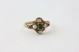 AN EMERALD AND PEARL RING WITH SMALL AMETHYSTS, POSSIBLY SUFFRAGETTE PIECE,