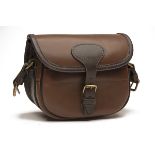 AN UNUSED CHOCOLATE LEATHER SUEDE-LINED CARTRIDGE BAG, with canvas and leather shoulder strap and