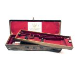 A BRASS-CORNERED LEATHER TWO TIER DOUBLE HAMMERGUN CASE, fitted for 30in. barrels, the interior