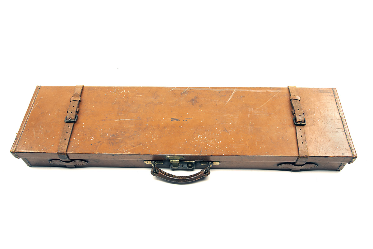 A LEATHER SINGLE GUNCASE, fitted for 30in. barrels, the interior lined with red baize, a Holland & - Image 2 of 2