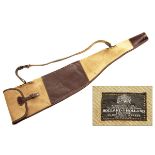 HOLLAND & HOLLAND A CANVAS AND LEATHER RIFLE SLIP, with leather shoulder strap and brass fittings.