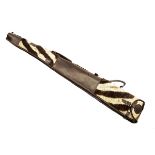 A LEATHER AND ZEBRA FUR FLEECE-LINED SINGLE GUNSLIP, with leather shoulder strap and brass fittings,